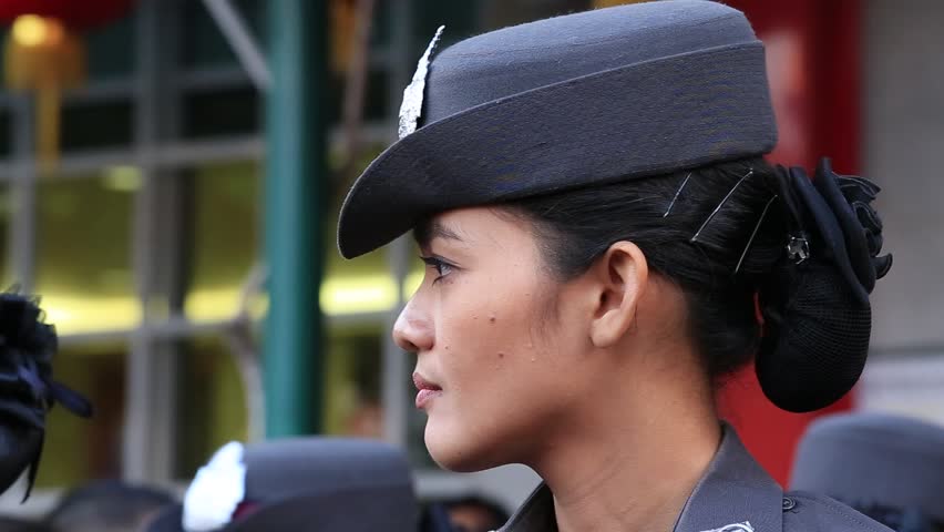 BANGKOK, THAILAND - FEBRUARY 08, 2016 : Unknown Thai woman police officer to keep order in the street Yaowarat during the celebration of Chinese New Year in Chinatown | Shutterstock HD Video #15922582
