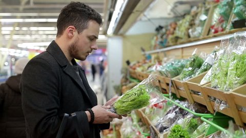 Man chooses products in the supermarket