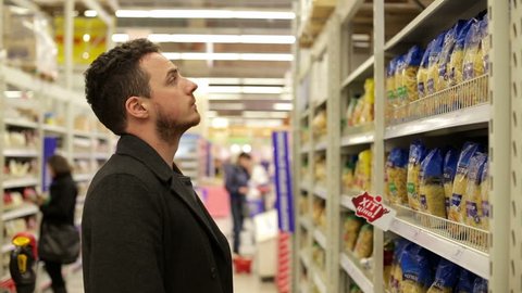 Man chooses products in the supermarket