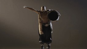 Shaman dancing with a drum on grey background.  Ethnic Asian Dance. Shot on RED EPIC DRAGON Cinema Camera in slow motion.