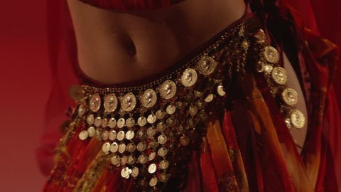 Beautiful traditional asian belly dancer.  Studio shoot . Shot on RED EPIC DRAGON Cinema Camera in slow motion.