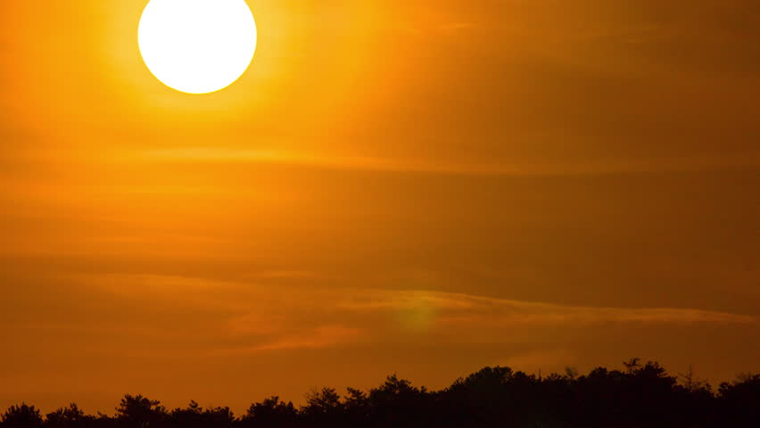 Sunset sunrise sun timelapse. Beautiful dawn nature landscape. Sky time lapse background. Orange yellow clouds, sun silhouette. Bright evening scenic sunset sunlight. Colorful dusk, big huge hot sun.  Royalty-Free Stock Footage #15957499