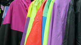 Jackets on hangers at a market stand