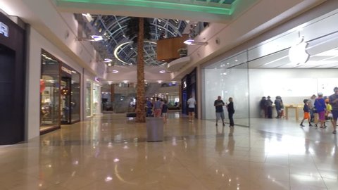 ORLANDO - APRIL 8: Walking through Mall at Millenia by the Apple Store which is an upscale indoor shopping mall opened in 2002 located at 4200 Conroy Rd April 8, 2016 in Orlando FL, USA