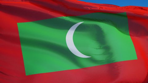 Maldives flag waving in slow motion against clean blue sky, seamlessly looped, close up, isolated on alpha channel with black and white luminance matte, perfect for film, news, digital composition