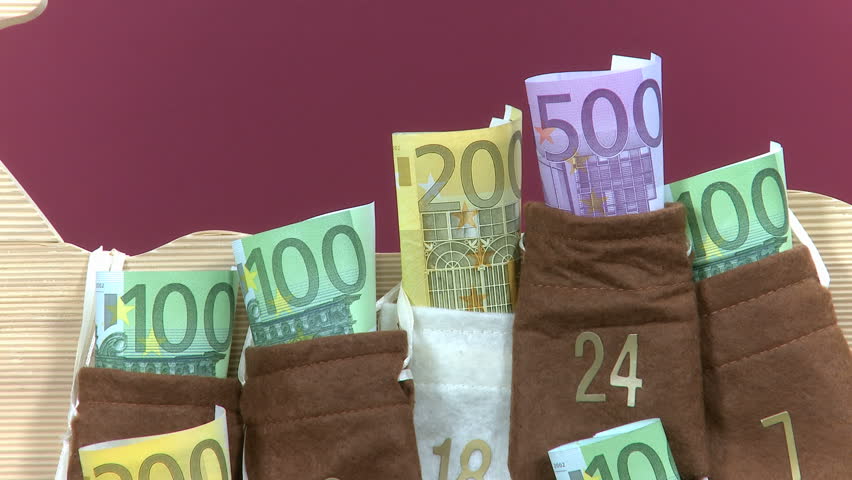 close up 500 Euro bill is taken out of an advent calendar