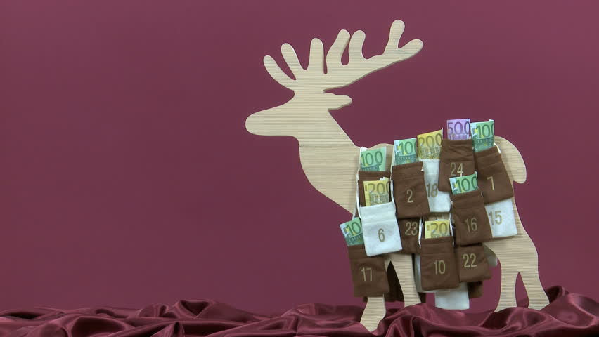 Euro bills are taken out of an advent calendar timelapse