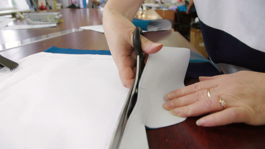 Tailor cutting the patterns with scissors | Shutterstock HD Video #15987487