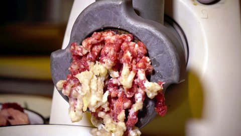 Forcemeat preparation in an electric meat   grinder.
