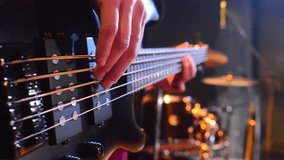 bass guitarist playing at a concert