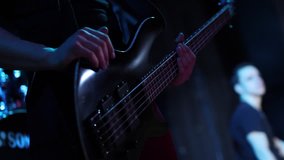 bass guitarist playing at a concert