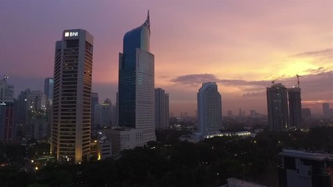 JAKARTA, INDONESIA - APRIL 15, 2016: A panned view of Jakarta business district along the city main avenue, Jalan Sudirman, which is lined with many banks HQ and other office towers. 