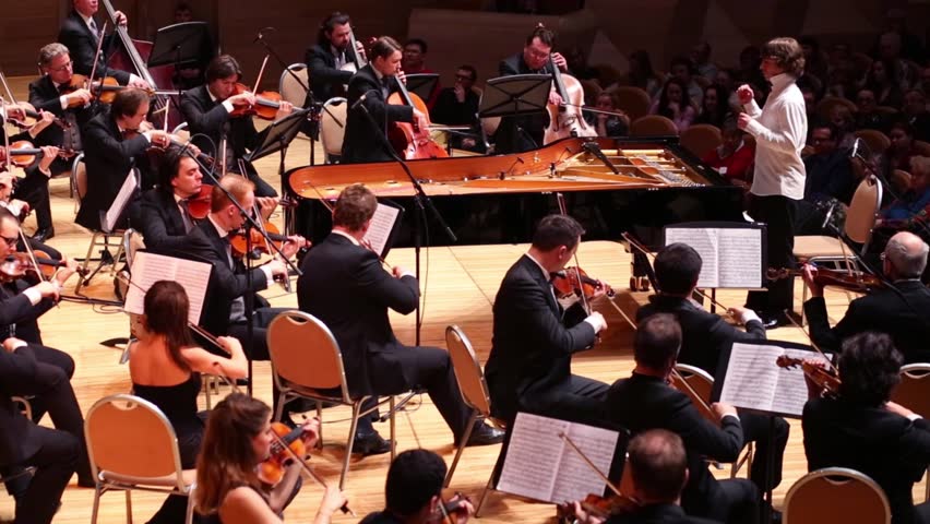 MOSCOW - APR 20, 2015: Violinists and conductor at concert devoted to 100th anniversary of David Ashkenazy in House of Music, Svetlanov hall
