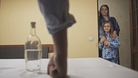 little girl with her mother and sister met an alcoholic father home. RAW video record.