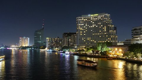 BANGKOK, THAILAND - JANUARY 2016: night light river traffic hotel bay bridge panorama 4k time lapse circa january 2016 bangkok, thailand.