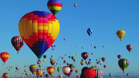 Balloons float across the sky at the Albuquerque Balloon Festival Stock Video