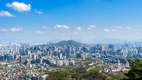Time lapse of Cityscape in Seoul with Seoul tower and blue sky, South Korea.