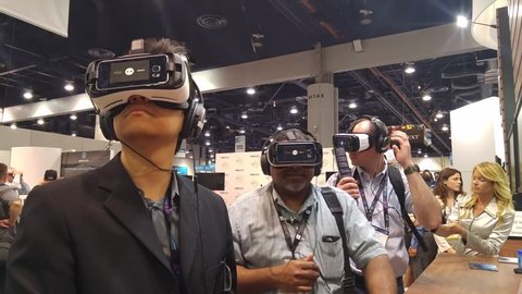 LAS VEGAS - April 20, 2016: Business people experiencing 360 Virtual Reality in VR headsets at NOKIA OZO booth at NAB 2016, an annual trade show by in Las Vegas Convention Center