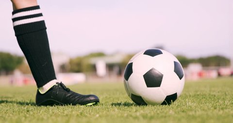 Football player kicking the ball in football field Video Stok