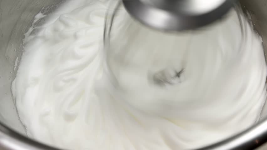 Whipped egg whites for cream in iron bowl | Shutterstock HD Video #16041919