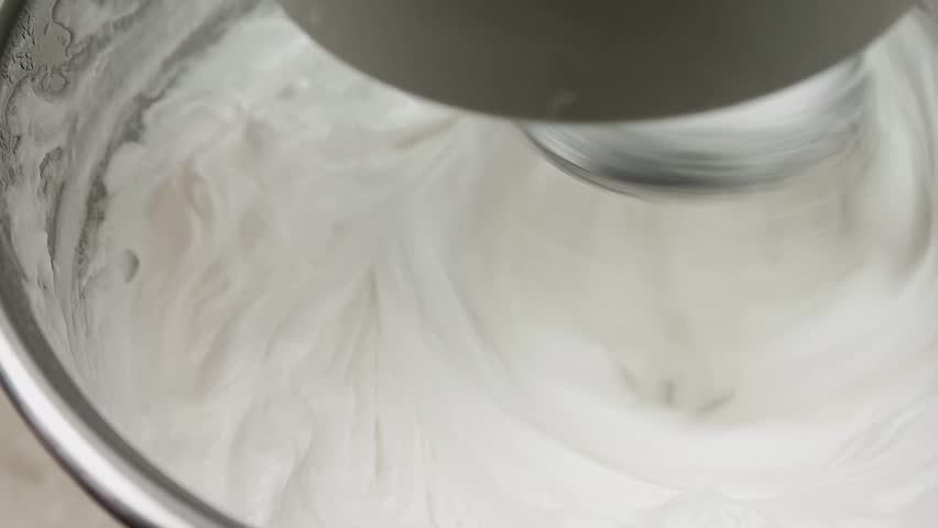 Slow motion, mixer whisking the egg whites to make cream | Shutterstock HD Video #16041946