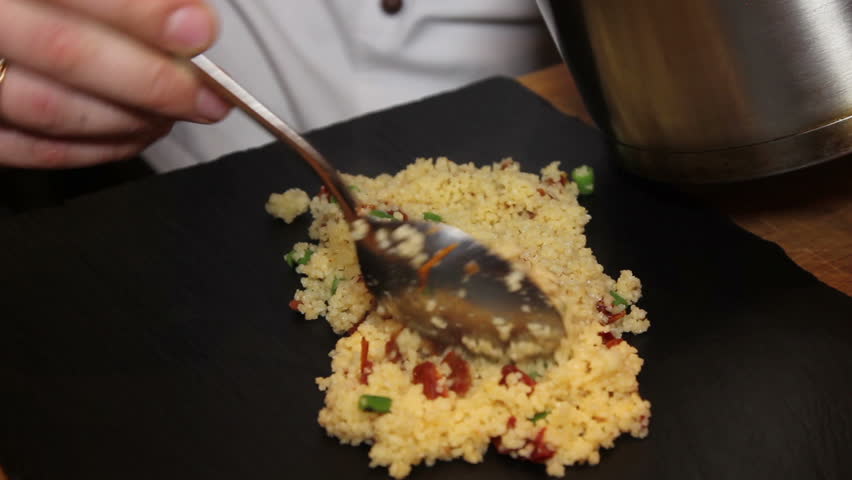 close up of chef puts Couscous to board food