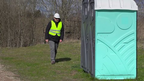 Worker go to in portable toilet