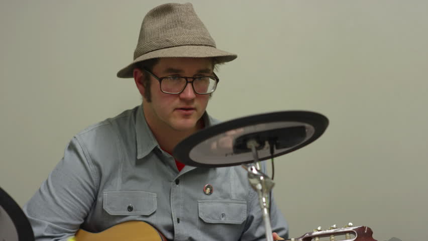 A girl taking guitar lessons