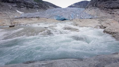 panoramic view on waterfall in Nigardsbreen glacier, Norway