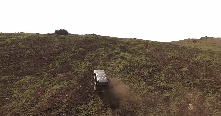 A Chevy Tahoe going up a mountain and seeing the valley in the distance. / Off Road SUV / Going Up A Mountain