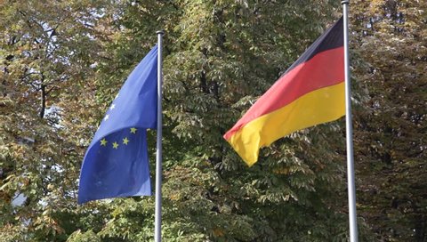 German and European flags flying together