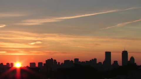 Timelapse of sunrise in big city.