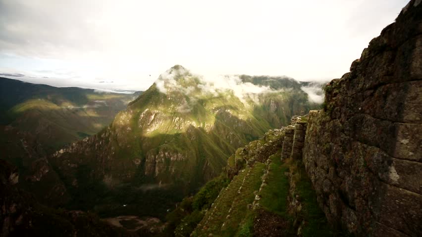 View from Machu Picchu to the scenery with rain forest and mountains on a rainy day.