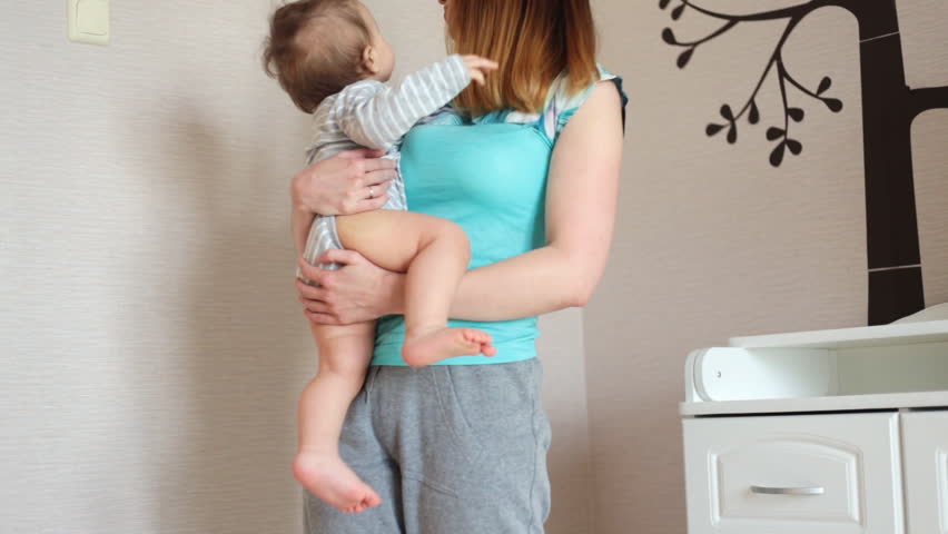 Mother and little son playing