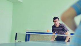 man  playing table tennis slow motion video sport backhand 