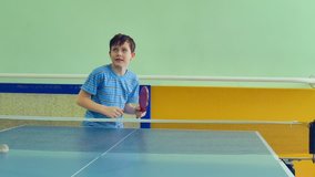 boy  playing table tennis slow motion video sport tops spin