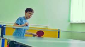 boy  playing table tennis sport slow motion video