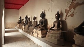 Line of black ancient Buddha statues 2