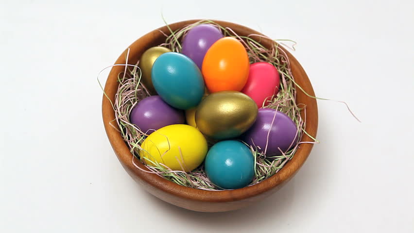 easter eggs in basket isolated white background