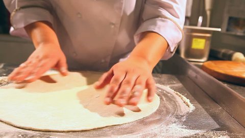 rolling dough of pizza