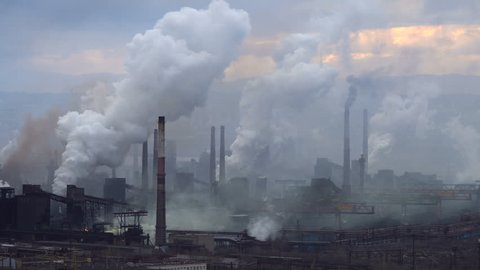 Air Pollution From Industrial Plants. Large Plant on the Background of the City. Pipes Throwing Smoke in the Sky