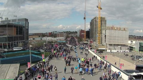 LONDON, ENGLAND - APRIL 23:  Football fans from Everton and Manchester United approach Wembley Stadium from Wembley Way prior to the Emirates FA Cup semi final on April 23, 2016 (2.7k, 25fps).