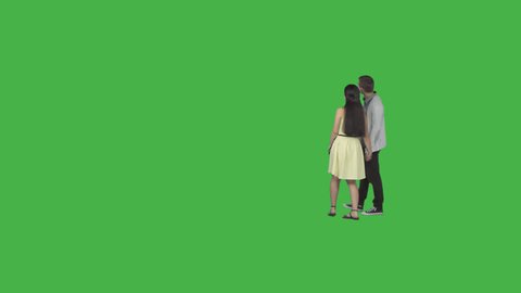 Guy & girl in yellow dress walks holding on hands and examines something. Footage with alpha channel. File format - .mov, codec PNG+Alpha. Shutter angle -180 (native motion blur)