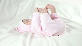 Baby in bunny costume on a white background