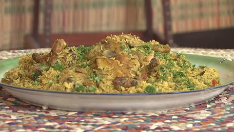 Arabic Food. Cu shot of a steaming dish of Mandi made with mutton, a traditional dish from Yemen but popular throughout the Gulf.