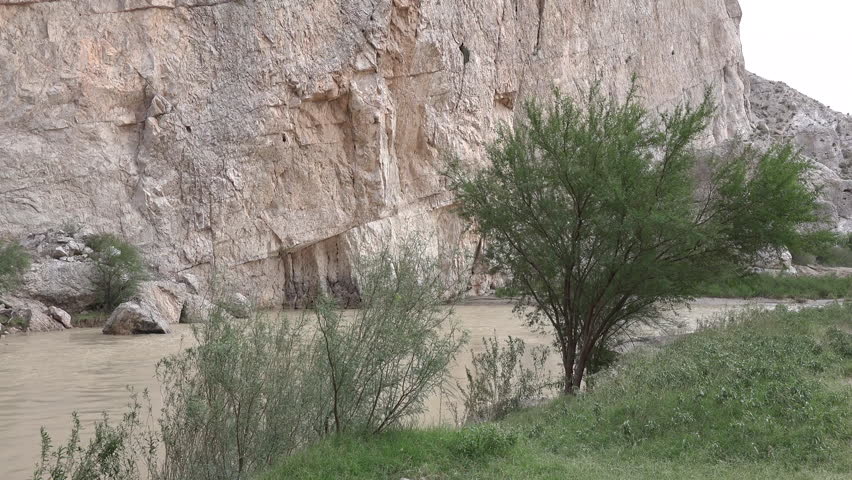 A cliff rises from the Rio Grande as the river enters Boquillas Canyon.