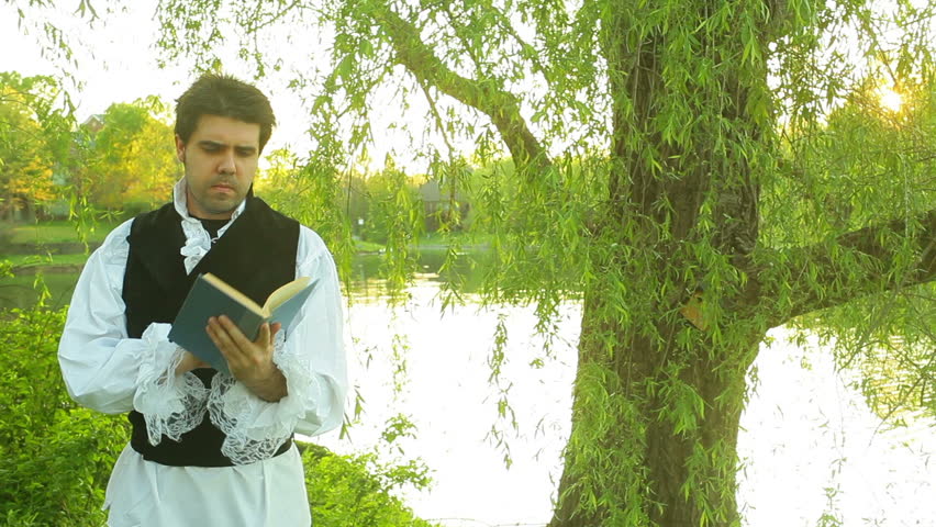 Victorian man or 18th century poet reading a book