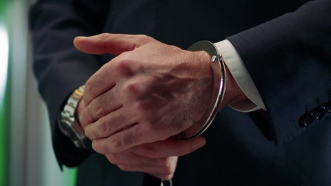   the hand in the handcuff