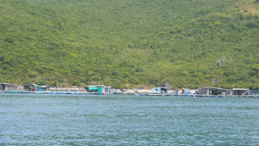 Floating fishing village, Vietnam. View from moving boat