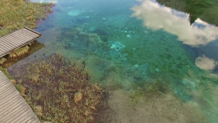 Two beautiful backpackers amaze in the beautiful lake